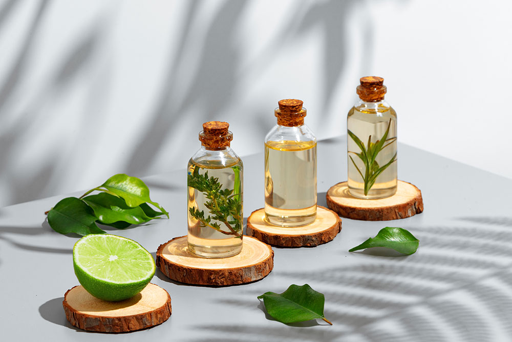 news-fruit-essential-oil-glass-bottle-gray-background